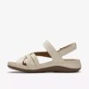 Cecily Strap kremfargede lærrem-sandaler for kvinner