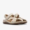 Cecily Strap kremfargede lærrem-sandaler for kvinner
