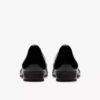 Krystine Lily – svarte slip-ons i lakkskinn for damer
